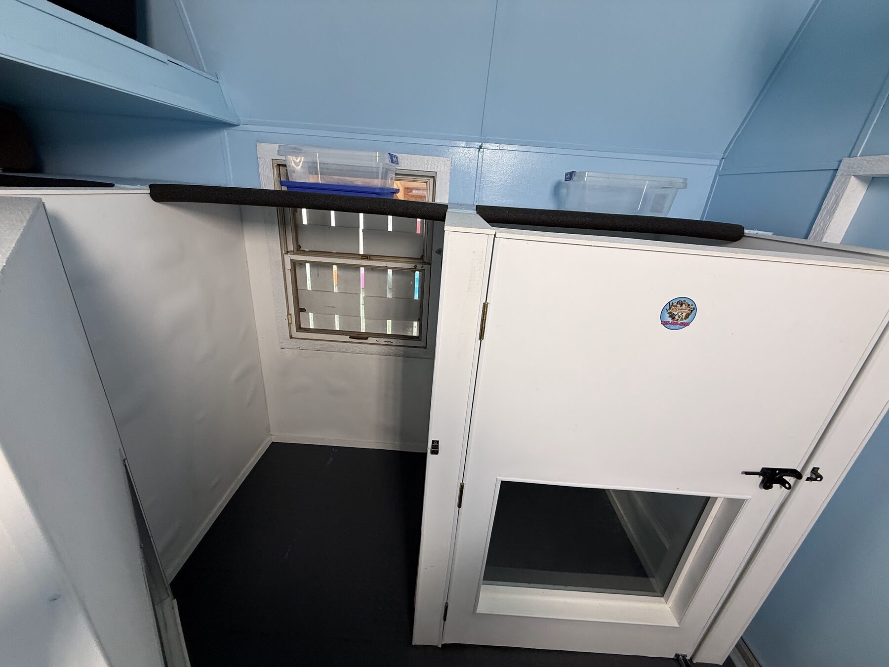 Inside a private sleeping suite, with a soft floor, a window for daylight and a door that latches shut